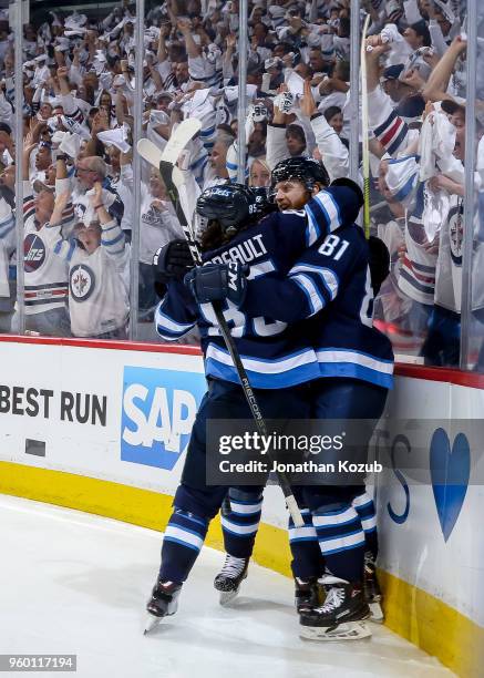 Mathieu Perreault, Bryan Little and Kyle Connor of the Winnipeg Jets celebrate a third period goal against the Vegas Golden Knights in Game Two of...