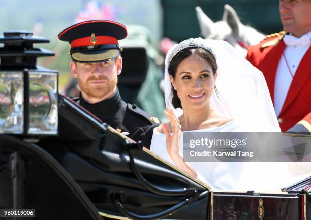 Prince Harry, Duke of Sussex and Meghan, Duchess of Sussex leave Windsor Castle in the Ascot Landau carriage during a procession after getting...