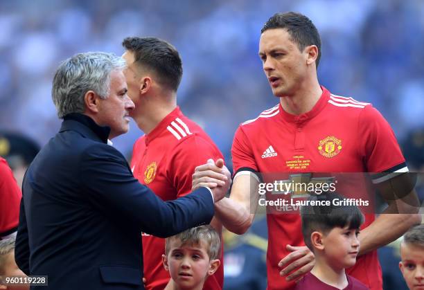 Jose Mourinho, Manager of Manchester United shakes hands with Nemanja Matic of Manchester United prior to The Emirates FA Cup Final between Chelsea...