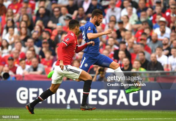 Olivier Giroud of Chelsea controls the ball under pressure from Chris Smalling of Manchester United during The Emirates FA Cup Final between Chelsea...