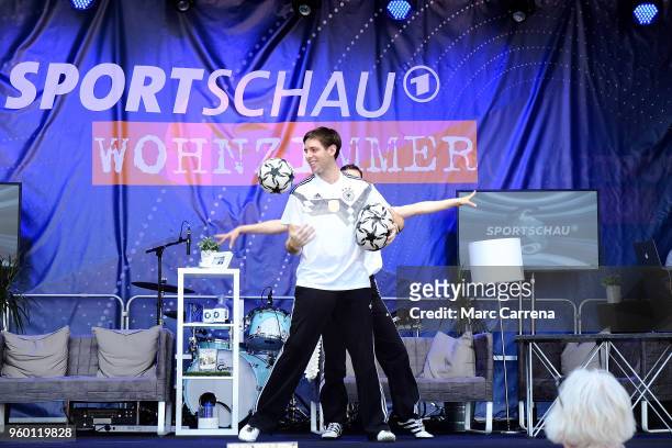 Ball artists show their skills on the Sportschau Wohnzimmer stage prior to the DFB Cup final between Bayern Muenchen and Eintracht Frankfurt at...