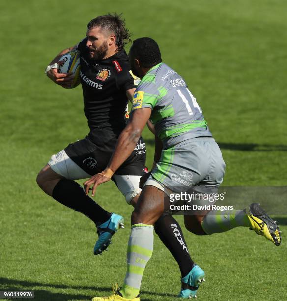 Don Armand of Exeter breaks away from Vereniki Goneva to score their final try during the Aviva Premiership Semi Final between Exeter Chiefs and...