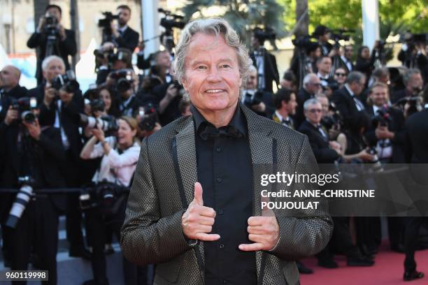 Actor John Savage gestures as she arrives on May 19, 2018 for the closing ceremony and the screening of the film "The Man Who Killed Don Quixote" at...