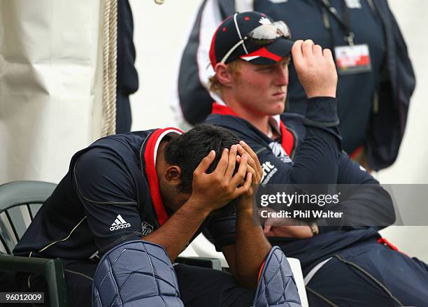 Ateeq Javid of England sits with his head in hins hands during the ICC U19 Cricket World Cup Quarter Final One match between England and the West...