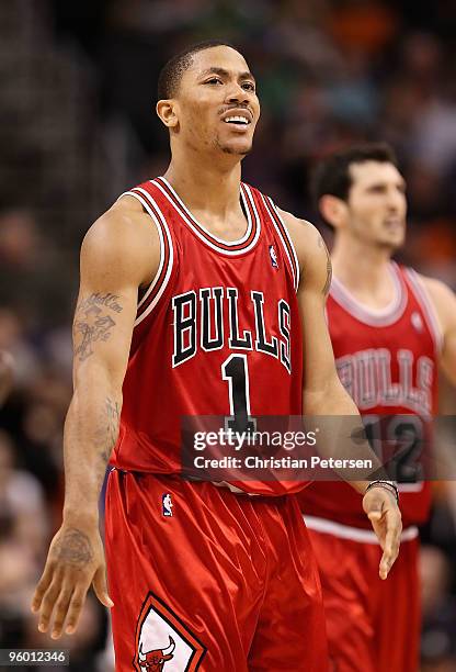 Derrick Rose of the Chicago Bulls reacts after a slam dunk against the Phoenix Suns during the NBA game at US Airways Center on January 22, 2010 in...