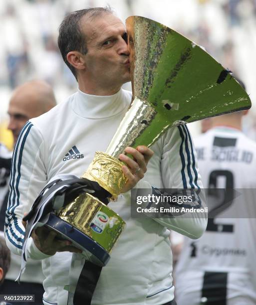 Juventus FC coach Massimiliano Allegri celebrates with the trophy after winning the Serie A Championship at the end of the serie A match between...