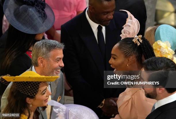 Actor George Clooney and his wife British lawyer Amal Clooney talk with US tennis player Serena Williams and her husband Alexis Ohanian during the...