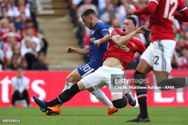 Phil Jones of Manchester United fouls Eden Hazard of Chelsea to concede a penalty during the Emirates FA Cup Final between Chelsea and Manchester...