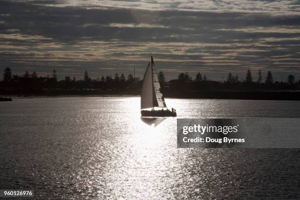 yacht at dusk - doug byrnes stock pictures, royalty-free photos & images