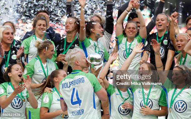 Nilla Fischer of Wolfsburg kisses the trophy after the Women's DFB Cup Final between VFL Wolfsburg and FC Bayern Muenchen at RheinEnergieStadion on...
