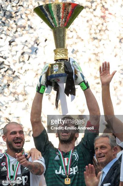 Gianluigi Buffon of Juventus FC lifts the Serie A trophy in his last match for the club as he celebrates winning the championship with team-mates at...