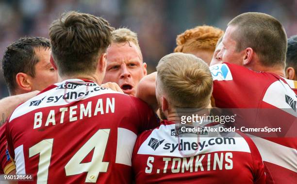 Warrington Wolves' Kevin Brown has words with Wigan Warriors' Sam Tomkins during the Betfred Super League Round 15 match between Wigan Warriors and...