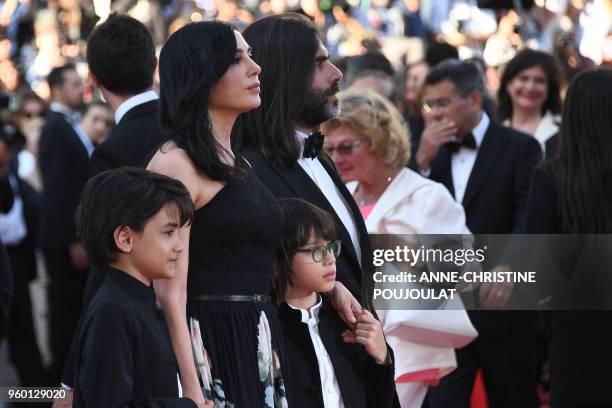 Lebanese director and actress Nadine Labaki , Syrian actor Zain al-Rafeea and Lebanese producer Khaled Mouzanar arrive on May 19, 2018 for the...