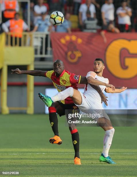 Younes Belhanda of Galatasaray in action against Demba Ba of Goztepe during Turkish Super Lig soccer match between Goztepe and Galatasaray at Bornova...