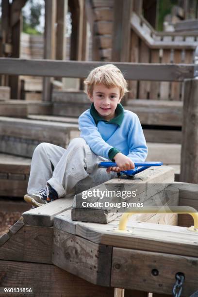 boy in playground - doug byrnes stock-fotos und bilder