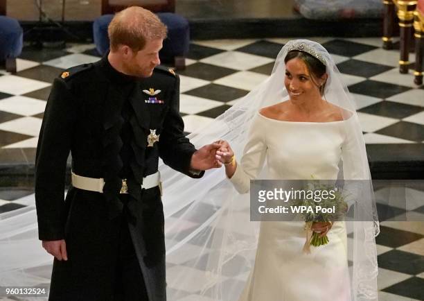 Prince Harry and Meghan Markle in St George's Chapel at Windsor Castle during their wedding service on May 19, 2018 in Windsor, England.