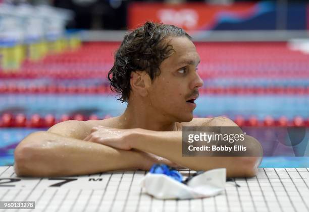 Tom Shields rests at the side of the pool after warming up during the fourth day of the TYR Pro Swim Series at Indiana University Natatorium on May...