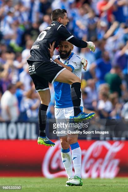 Ander Serantes of Leganes celebrates with Dimitrios Siovas his team second goal during the La Liga match between Leganes and Real Betis at Estadio...