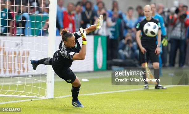 Goalkeeper Almuth Schult of Wolfsburg saves a penalty kick during the Women's DFB Cup Final between VFL Wolfsburg and FC Bayern Muenchen at...