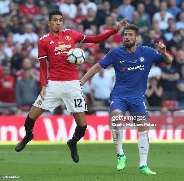 Chris Smalling of Manchester United in action with Olivier Giroud of Chelsea during the Emirates FA Cup Final match between Manchester United and...