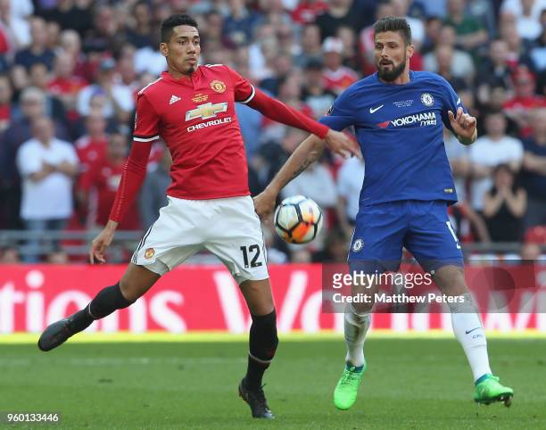 Chris Smalling of Manchester United in action with Olivier Giroud of Chelsea during the Emirates FA Cup Final match between Manchester United and...