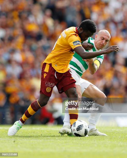 Gael Bigirimana of Motherwell vies with Scott Brown of Celtic during the Scottish Cup Final between Celtic and Motherwell at Hampden Park on May 19,...