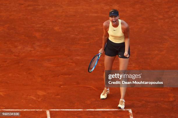 Maria Sharapova of Russia screams after winning a point in her semi final match against Simona Halep of Romania during day 7 of the Internazionali...