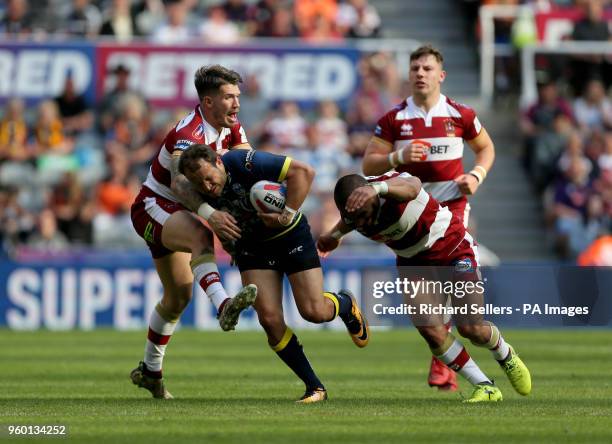 Warrington's Tyrone Roberts is tackled by Wigan Warriors Oliver Gildart during the Betfred Super League, Magic Weekend match at St James' Park,...