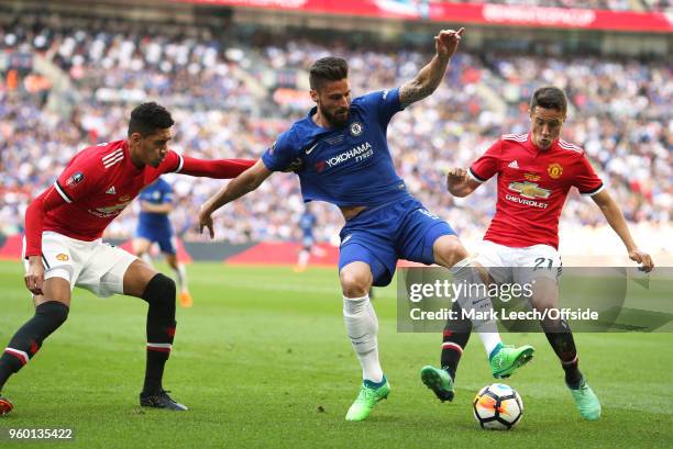 Olivier Giroud of Chelsea is challenged by Chris Smalling and Ander Herrera of United during the Emirates FA Cup Final between Chelsea and Manchester...