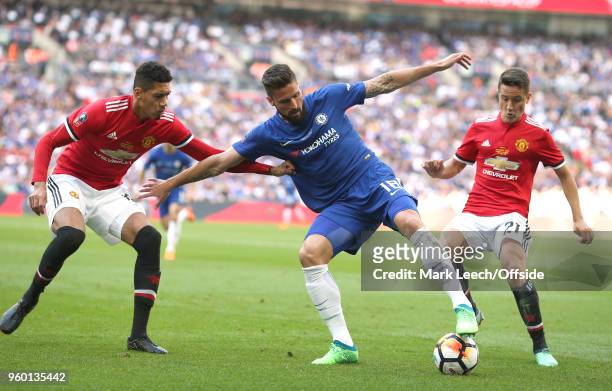 Olivier Giroud of Chelsea is challenged by Chris Smalling and Ander Herrera of United during the Emirates FA Cup Final between Chelsea and Manchester...