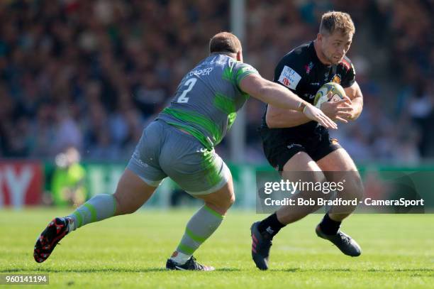 Exeter Chiefs' Sam Hill is tackled by Newcastle Falcons' Kyle Cooper during the Aviva Premiership Semi Final between Exeter Chiefs and Newcastle...