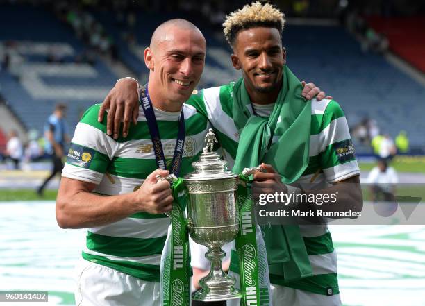 Scott Brown , and Scott Sinclair of Celtic celebrates as Celtic beat Motherwell 2-0 during the Scottish Cup Final between Celtic and Motherwell at...