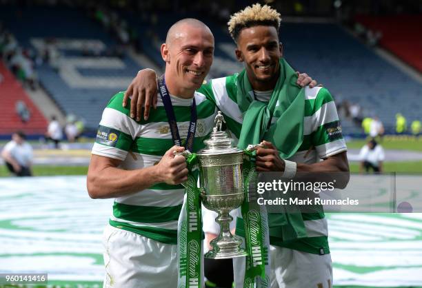 Scott Brown , and Scott Sinclair of Celtic celebrates as Celtic beat Motherwell 2-0 during the Scottish Cup Final between Celtic and Motherwell at...