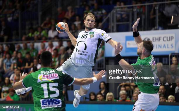 Paul Drux of Fuechse Berlin competes with Zarko Sesum and Jacob Bagersted of Goeppingen during the Ottostadt Magdeburg EHF Cup Final Four 2018...