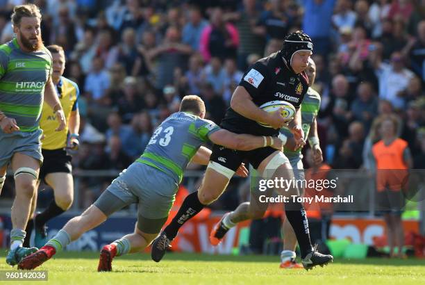 Thomas Waldrom of Exeter Chiefs is tackled by Alex Tait of Newcastle Falcons during the Aviva Premiership Semi Final between Exeter Chiefs and...