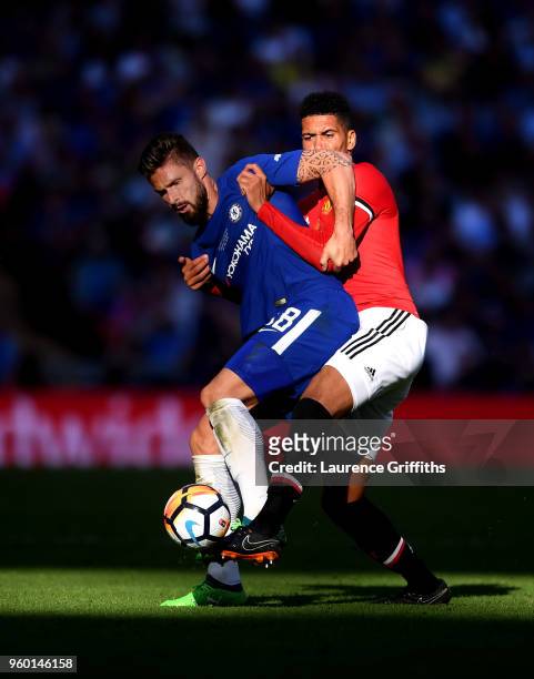 Olivier Giroud of Chelsea is challenged by Chris Smalling of Manchester United during The Emirates FA Cup Final between Chelsea and Manchester United...