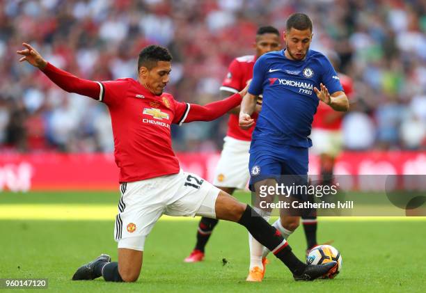 Chris Smalling of Manchester United tackles Eden Hazard of Chelsea during The Emirates FA Cup Final between Chelsea and Manchester United at Wembley...