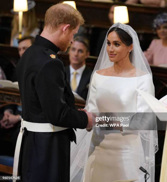 Prince Harry and Meghan Markle during their wedding service, conducted by the Archbishop of Canterbury Justin Welby in St George's Chapel at Windsor...