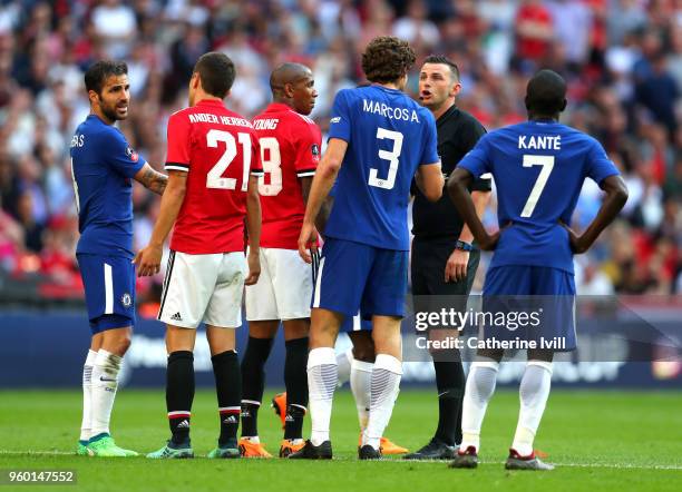 Marcos Alonso of Chelsea confronts referee Michael Oliver during The Emirates FA Cup Final between Chelsea and Manchester United at Wembley Stadium...