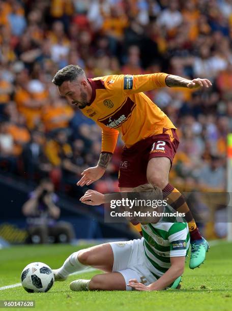 James Forrest of Celtic is tackled by Ryan Bowman of Motherwell during the Scottish Cup Final between Celtic and Motherwell at Hampden Park on May...