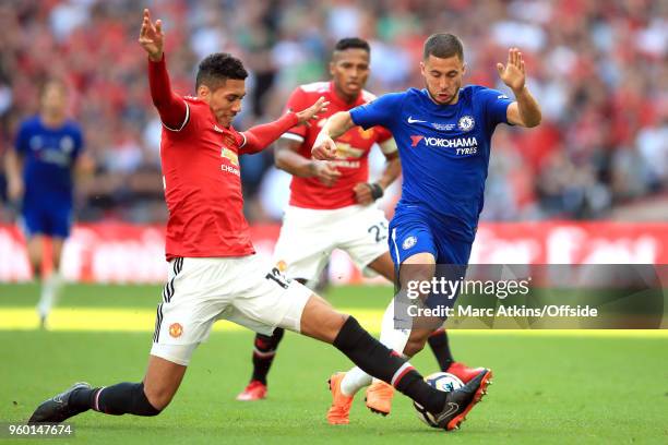 Chris Smalling of Man Utd stretches to tackle Eden Hazard of Chelsea during the Emirates FA Cup Final between Chelsea and Manchester United at...