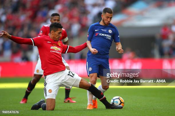 Chris Smalling of Manchester United challenges Eden Hazard of Chelsea during the Emirates FA Cup Final between Chelsea and Manchester United at...