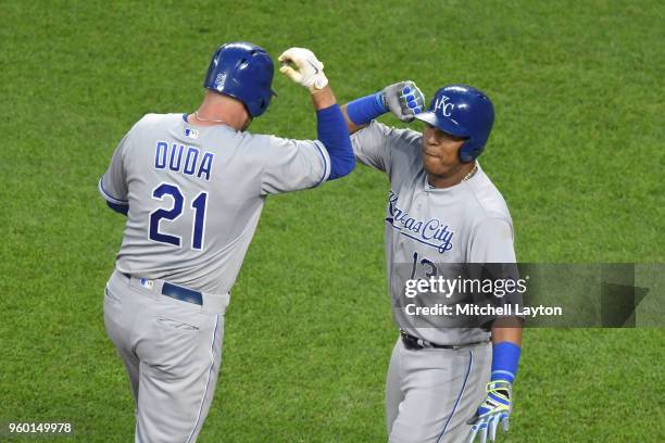 Lucas Duda of the Kansas City Royals celebrates a home run with Salvador Perez during a baseball game against the Baltimore Orioles at Oriole Park at...