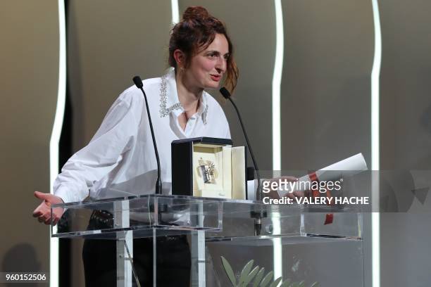Italian director Alice Rohrwacher delivers a speech after she was ex-aequo awarded with the Best Screenplay prize for the film "Lazzaro Felice " on...