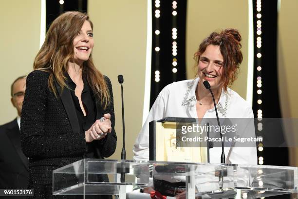 Chiara Mastroianni looks on as director Alice Rohrwacher receives the the Best Screenplay award for Happy As Lazzaro on stage during the Closing...