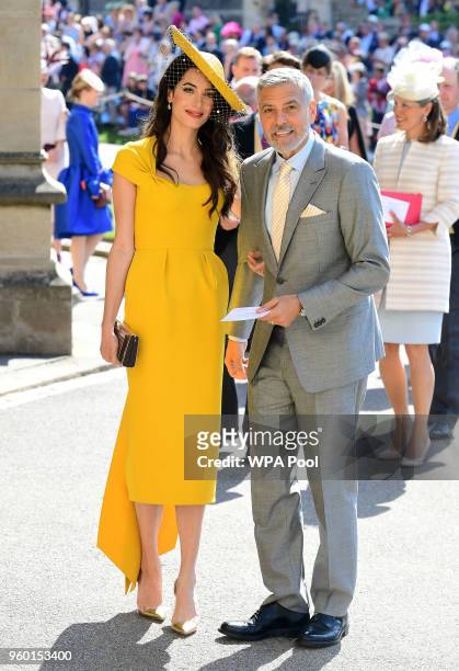 Amal and George Clooney arrive at St George's Chapel at Windsor Castle before the wedding of Prince Harry to Meghan Markle on May 19, 2018 in...