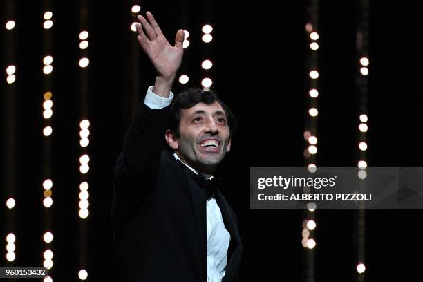 Italian actor Marcello Fonte celebrates after he was awarded with the Best Actor Prize for his part in the film "Dogman" on May 19, 2018 during the...