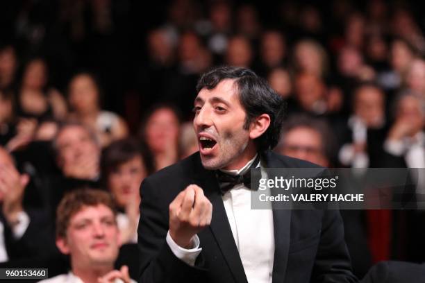 Italian actor Marcello Fonte reacts on May 19, 2018 after he was awarded with the Best Actor Prize for his part in "Dogman" at the 71st edition of...