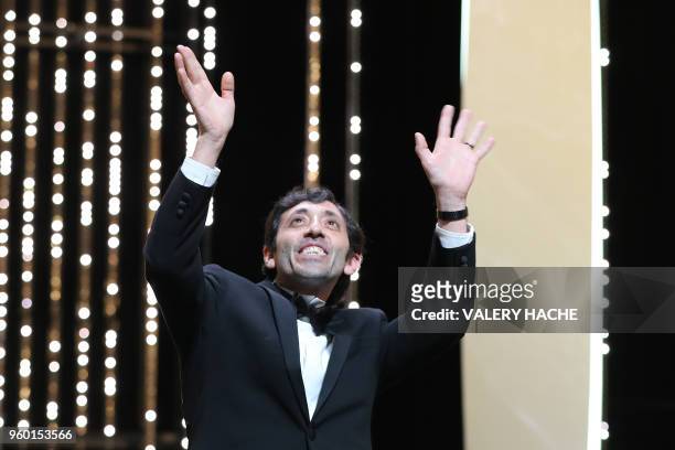 Italian actor Marcello Fonte reacts on stage on May 19, 2018 after he was awarded with the Best Actor Prize for his part in "Dogman" at the 71st...