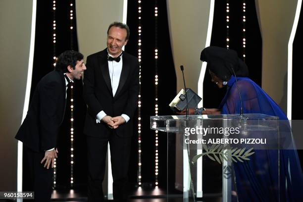 Italian actor Marcello Fonte receives the Best Actor Prize for his part in the film "Dogman" from Burundian singer and member of the Feature Film...